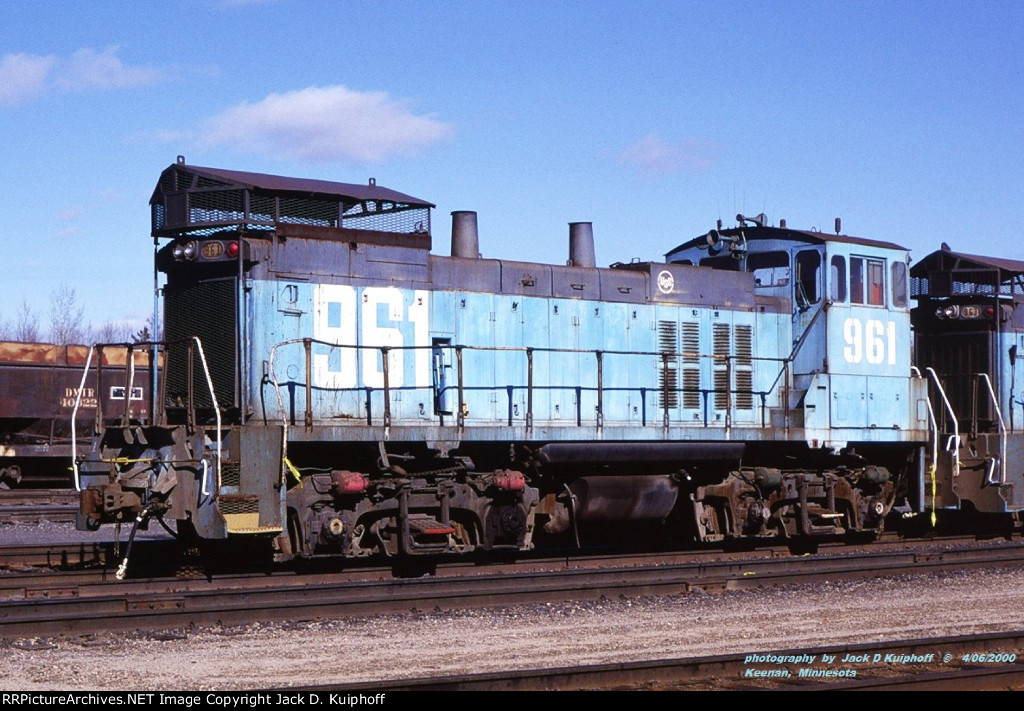 USSX, US Steel, 961, MP15DC, ex-MinnTac, now CP 1440, at DM&IR yard at Keenan, Minnesota. April 6, 2000. 